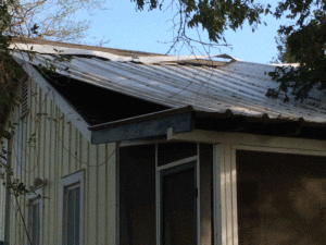 Photo of roof damage on our house.